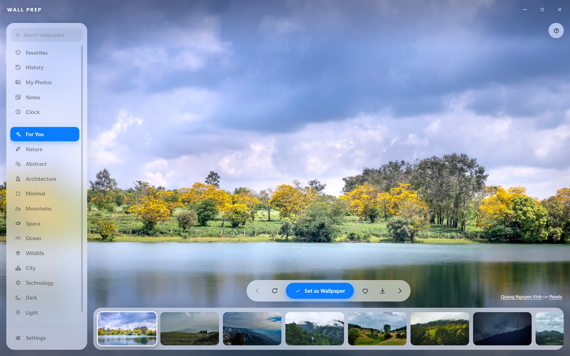 Wall Prep's browse view: a glass sidebar of categories over a full-window wallpaper preview with a filmstrip of photos below